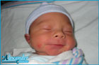 Alex smiling after an early diaper change Alex smiling after an early diaper change