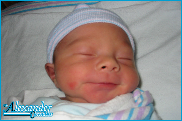 Alex smiling after an early diaper change Alex smiling after an early diaper change